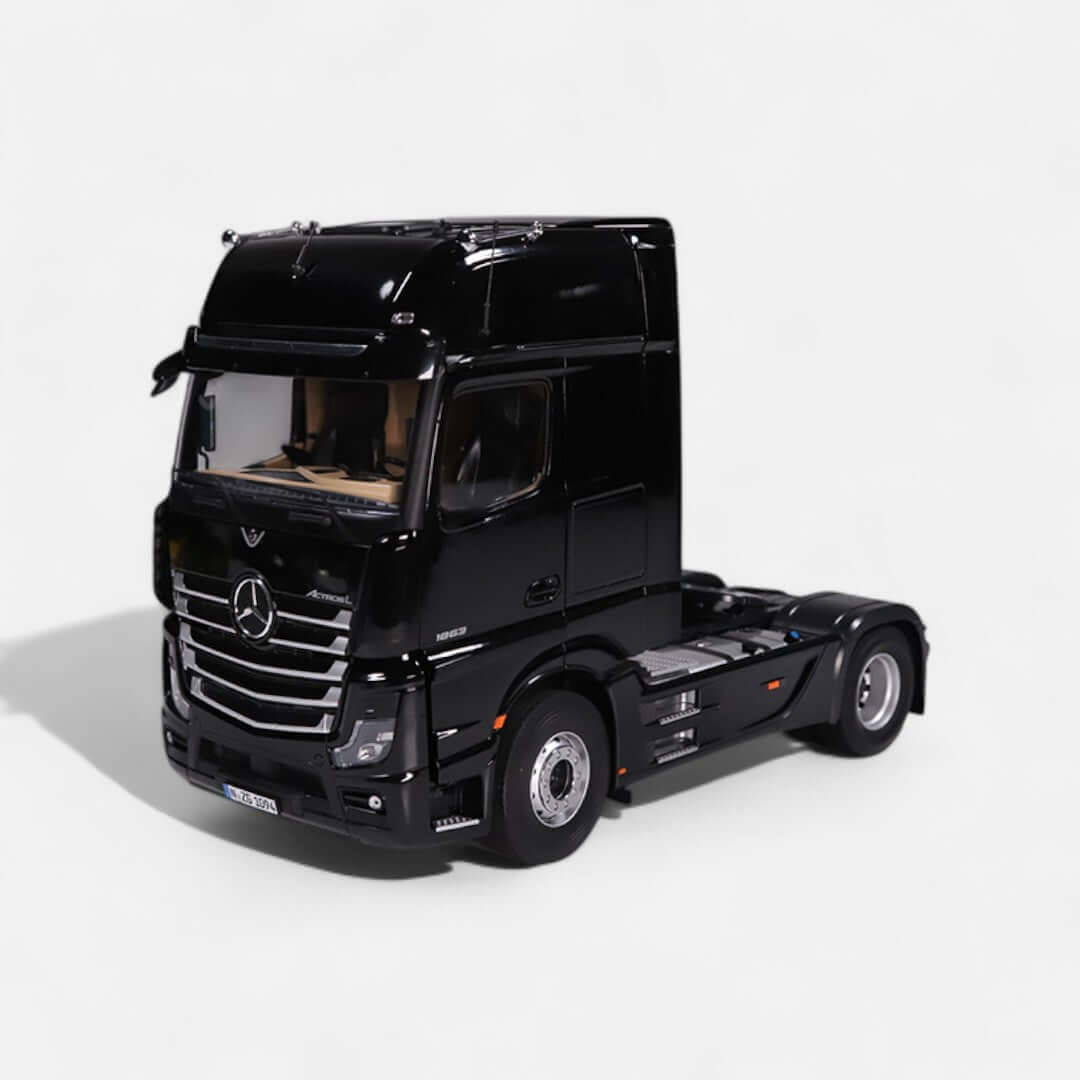 Mercedes-Benz Actros L 1:18 scale model truck in black with detailed interior and exterior features.