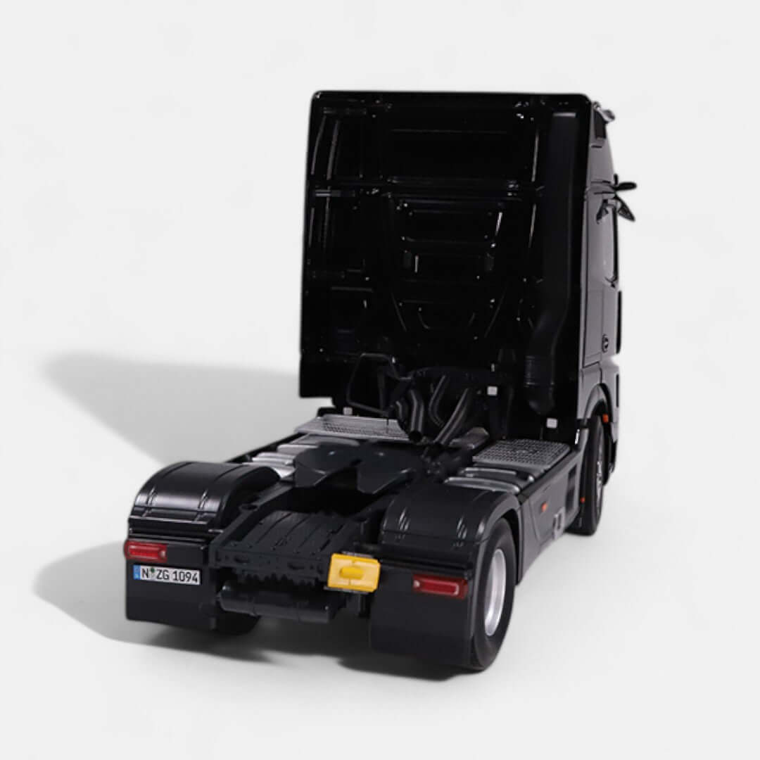 Mercedes-Benz Actros L model in 1:18 scale, showcasing detailed rear view with open cab and realistic design.